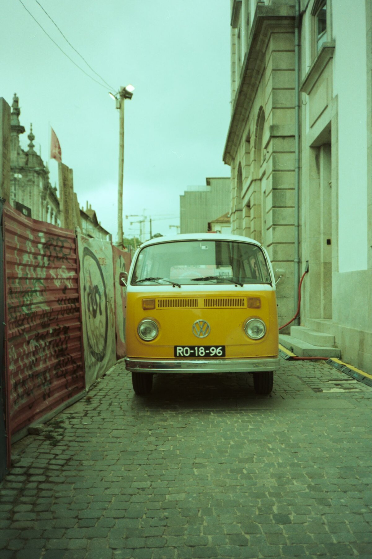 Yellow VW Type 2, sun-faded street